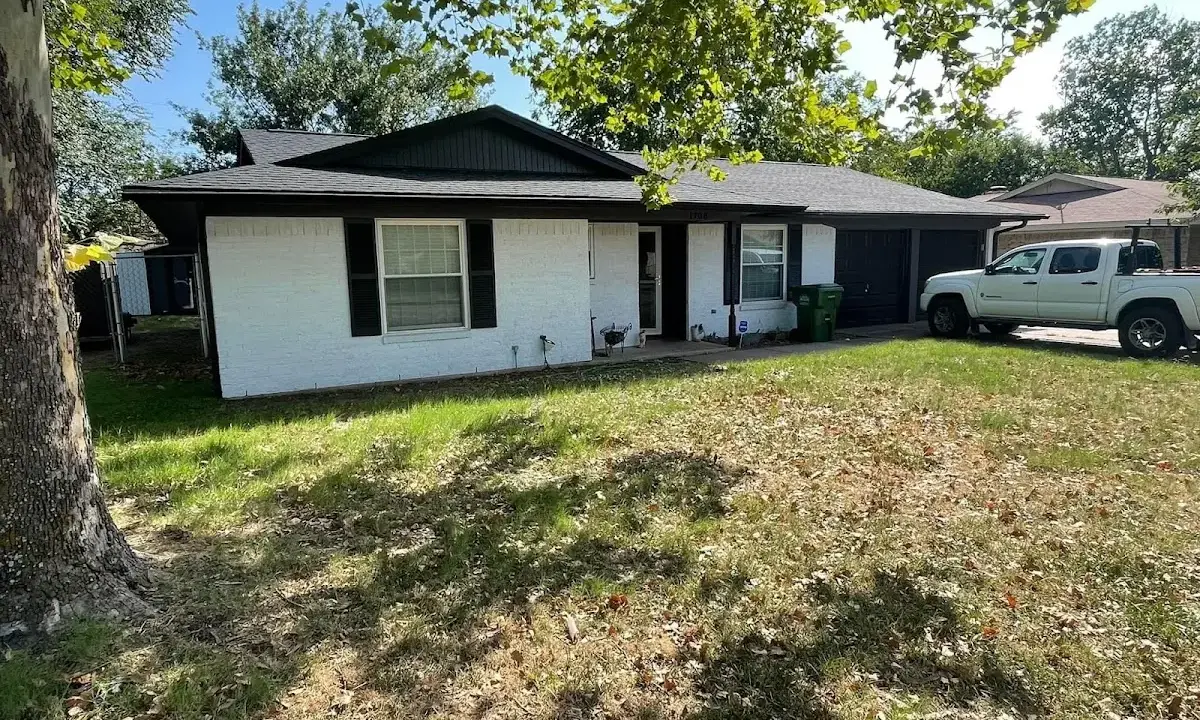 Professional roofing crew working on a residential roof in Lower Moreland